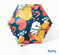 Colorful floral-patterned umbrella with 'TUTU.' branding on a white background
