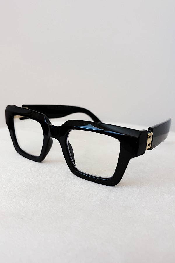 Black eyeglasses on a light gray background