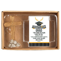 Graduation-themed gift set with cross, card, and stones in a box