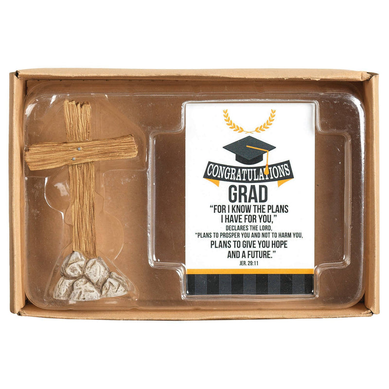Graduation-themed gift set with cross, card, and stones in a box