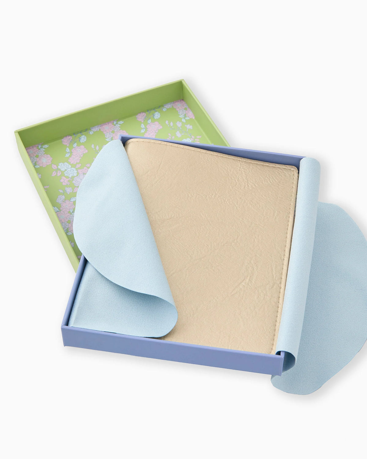Box with a beige card holder and blue paper inside on a white background
