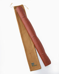 Brown Leather Mahjong Mat rolled in a canvas bag
