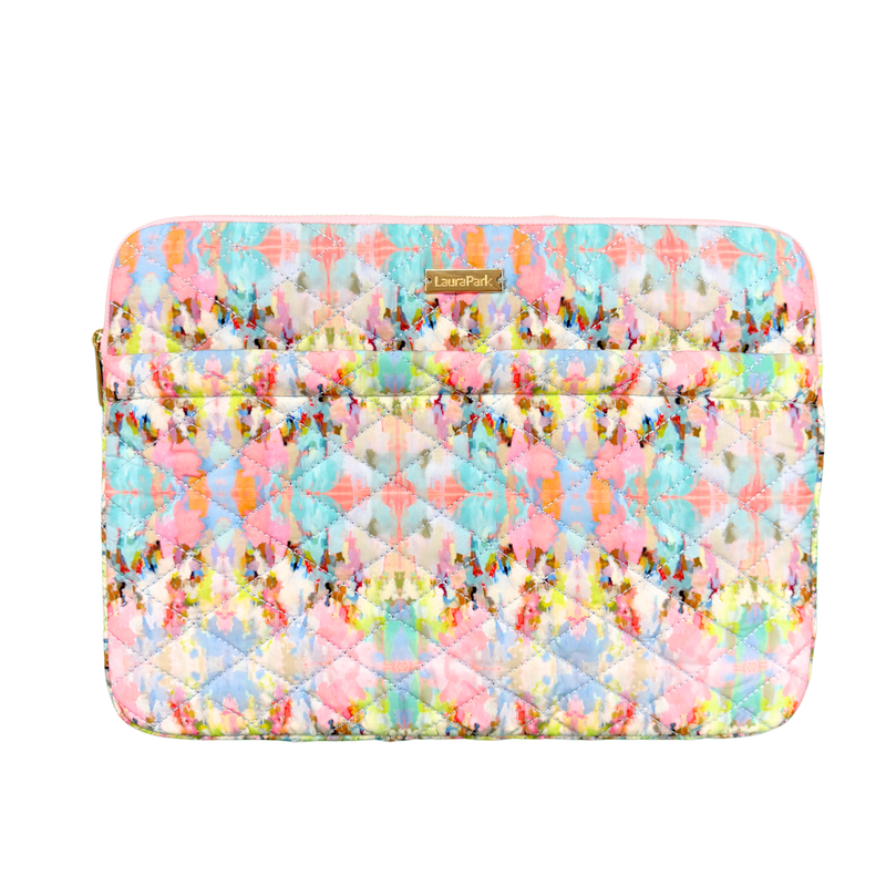Colorful quilted laptop sleeve with a pattern on a white background