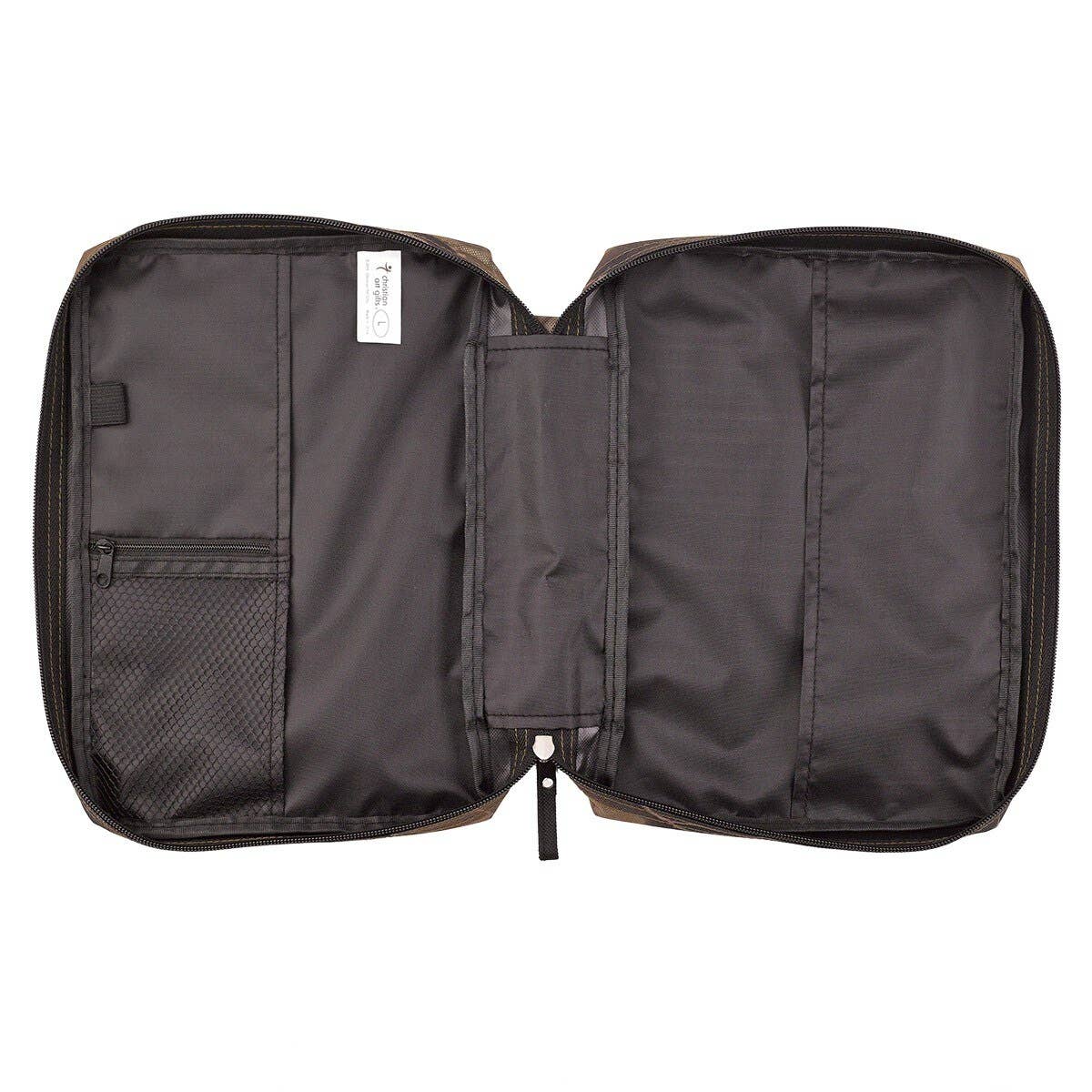 Open black travel bag with compartments on a white background