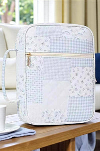 Floral-patterned bag on a table with a blurred background