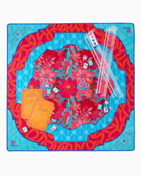 Colorful mahjong mat with floral design on a blue background