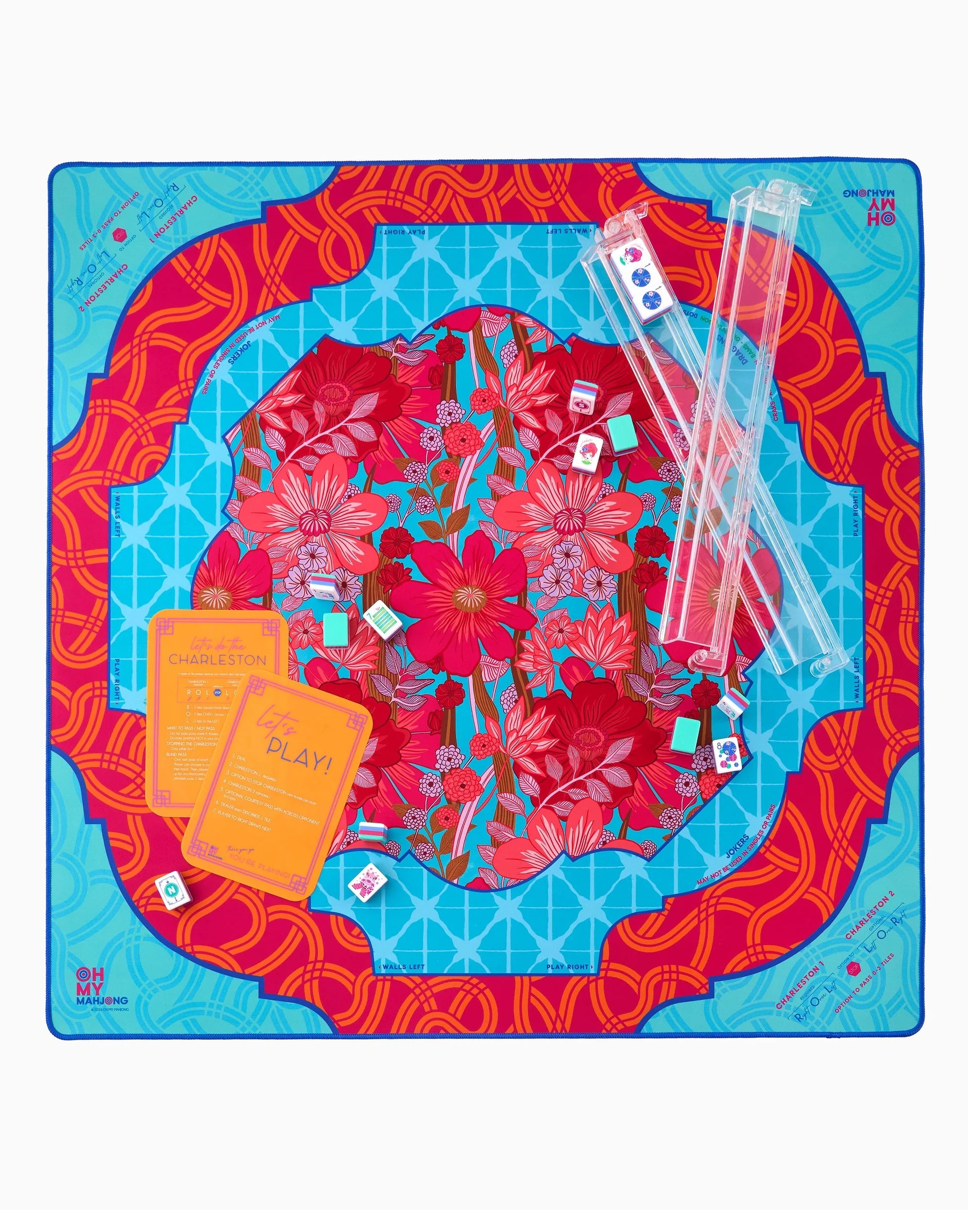 Colorful mahjong mat with floral design on a blue background