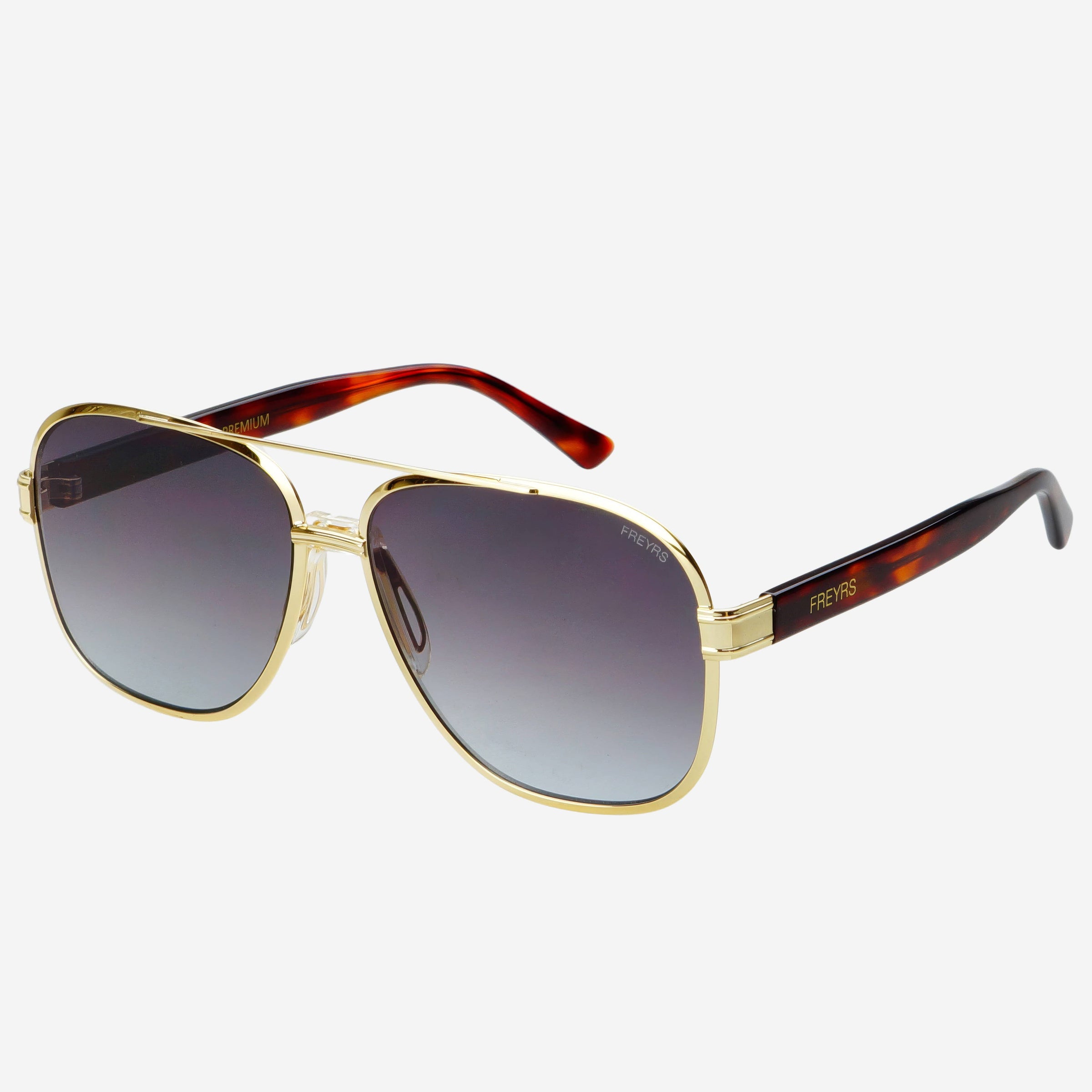 Gold-framed sunglasses with gradient lenses on a white background