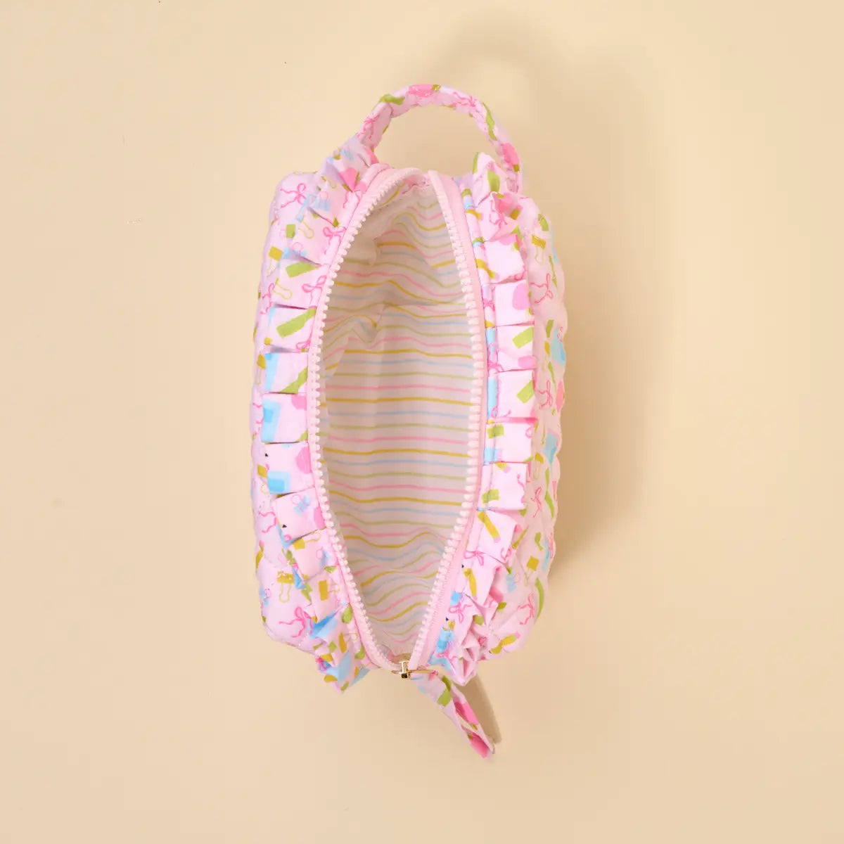 Pink baby seat cover with colorful patterns on a beige background