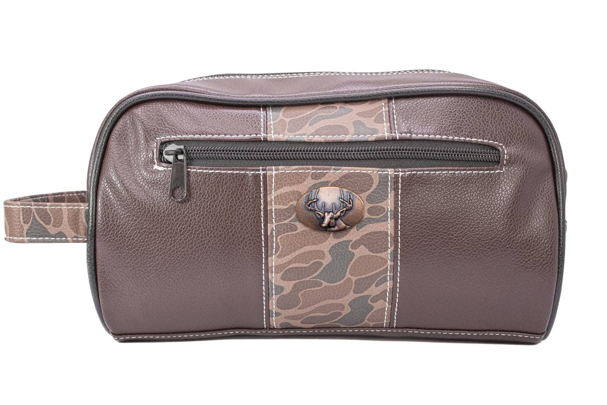 Brown leather toiletry bag with camouflage pattern and gold button on a white background