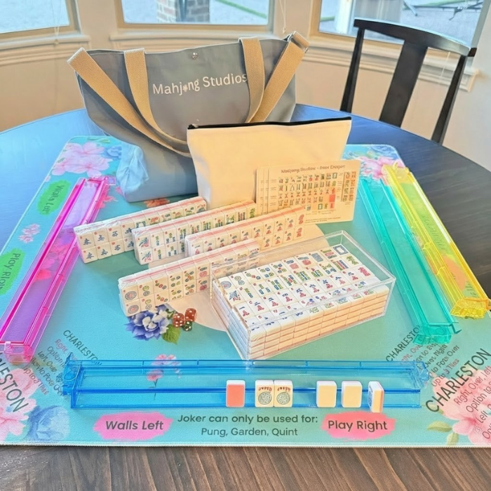 Mahjong game set with bags and boards on a table
