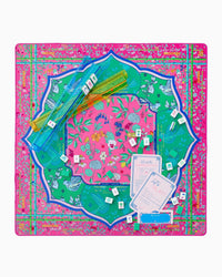 Colorful decorative mat with floral and bird patterns on a pink background