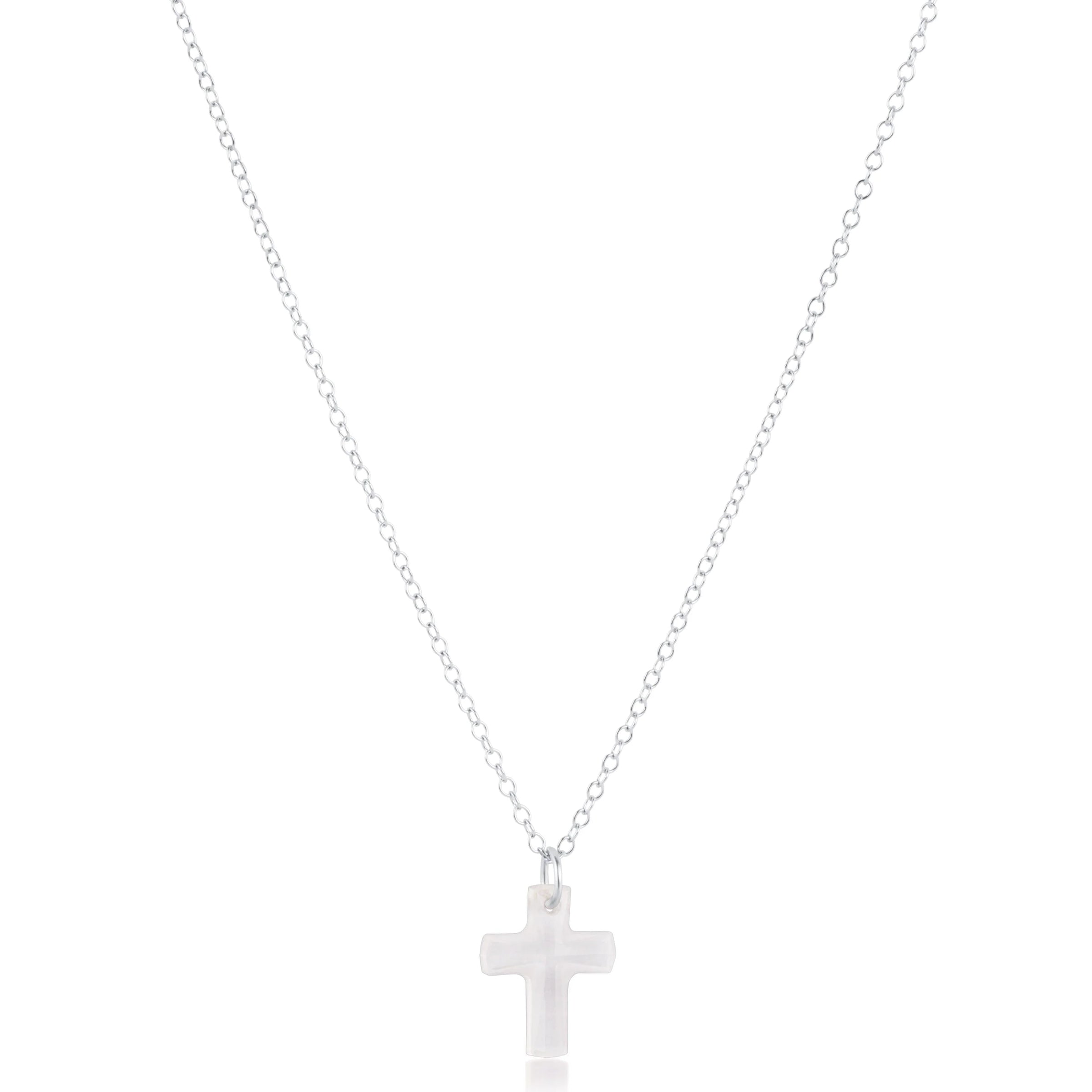 Silver cross necklace on a white background