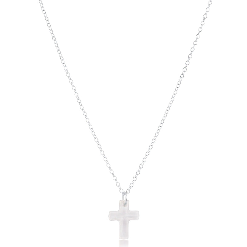 Silver cross necklace on a white background