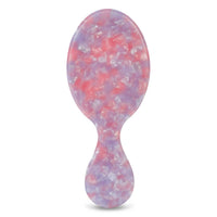 Back of hairbrush in purple, pink, and white mosaic
