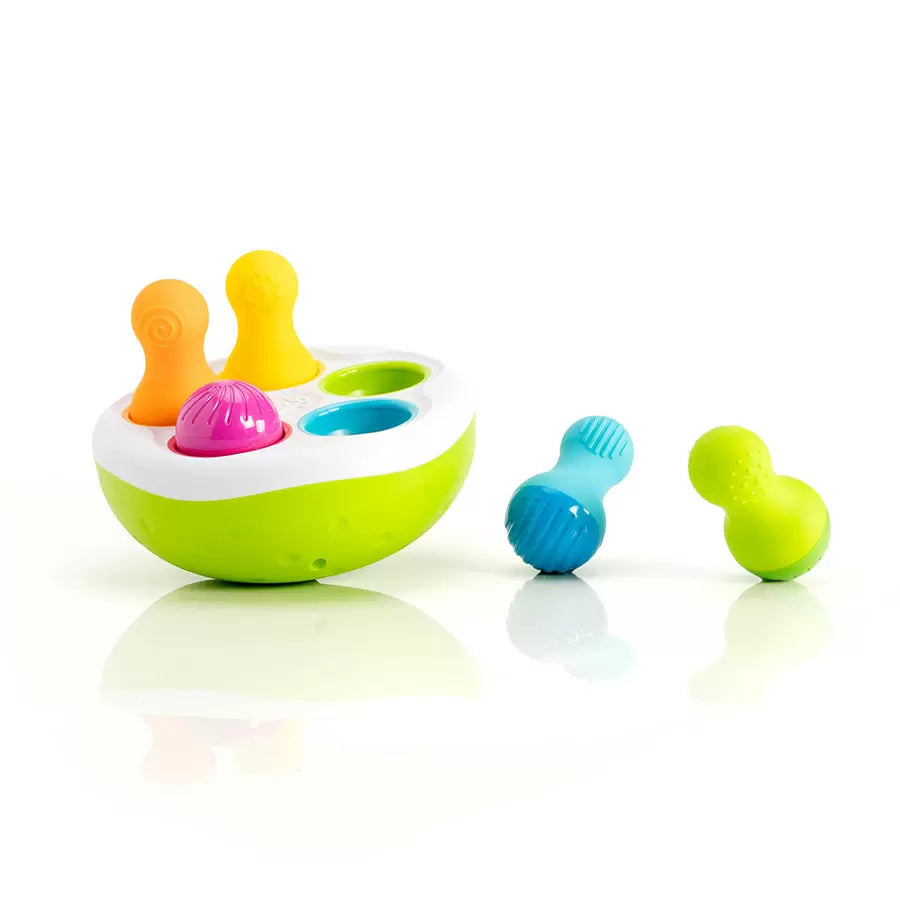Colorful bath toy set with a bowl and various shaped blocks on a white background