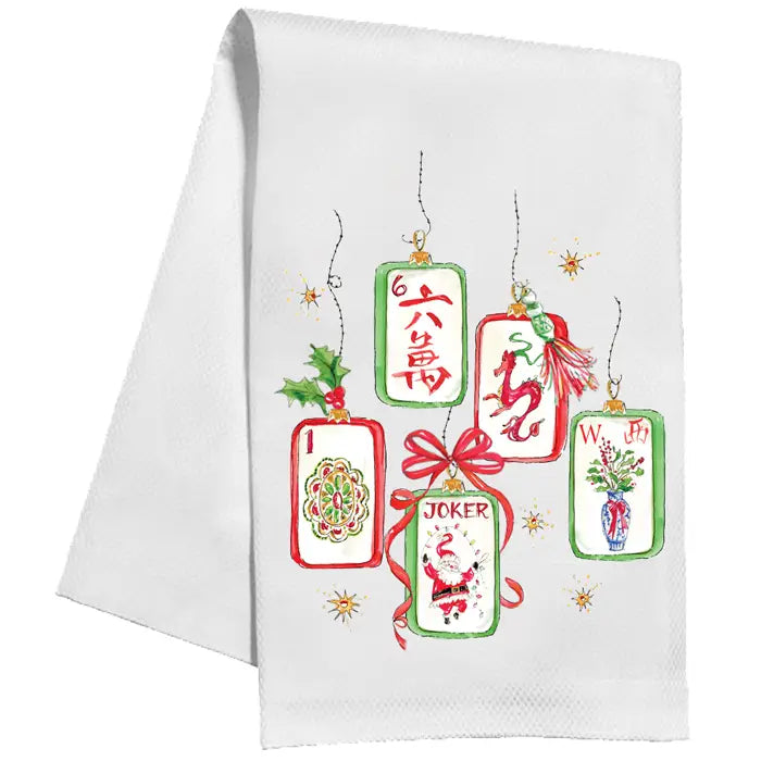 A white kitchen towel featuring a festive Christmas-themed graphic of five hanging playing card tags with red bows and holiday illustrations, shown against a plain white background.