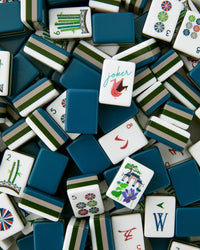 Collection of colorful Mahjong tiles with various symbols and a 'joker' tile.