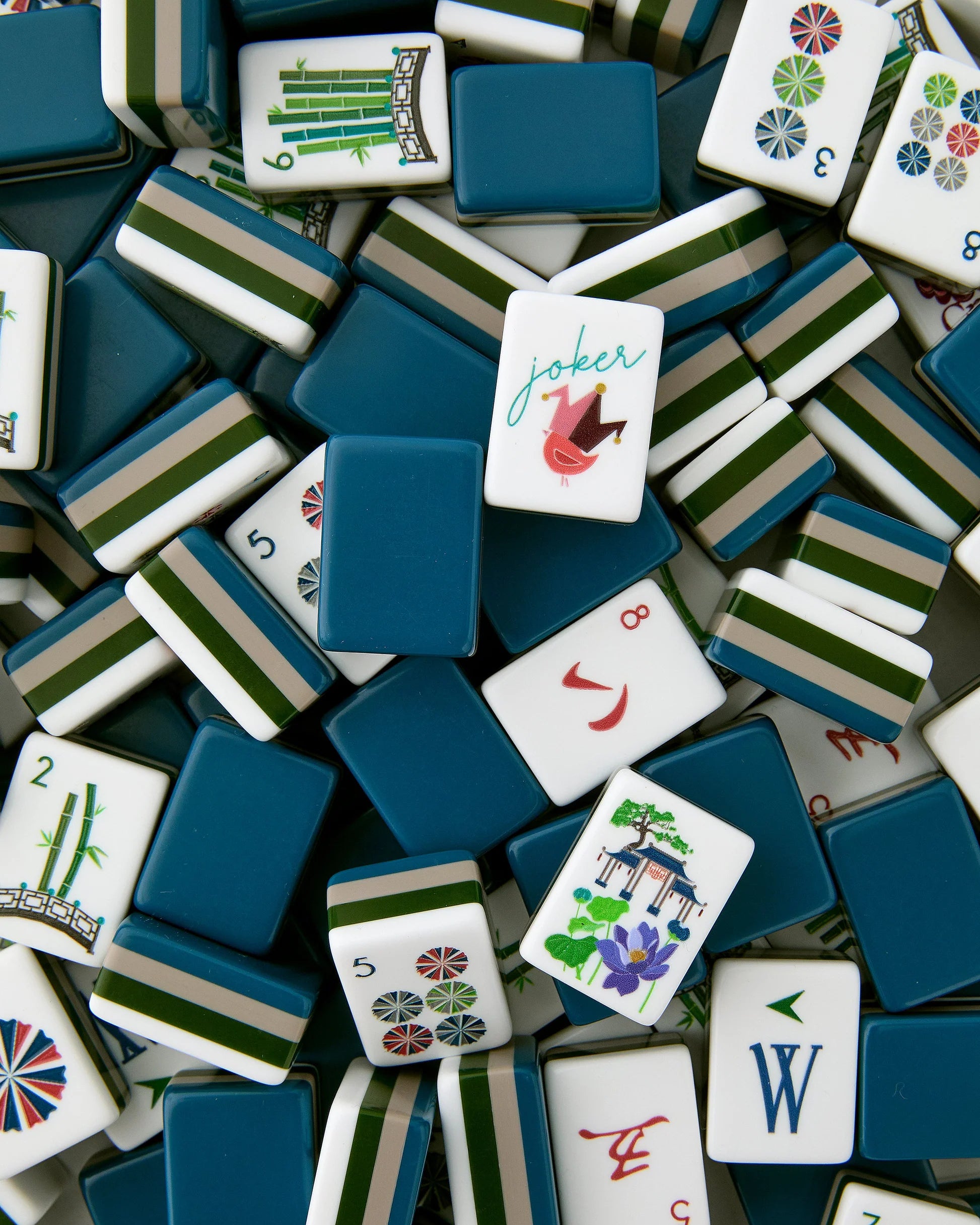 Collection of colorful Mahjong tiles with various symbols and a 'joker' tile.