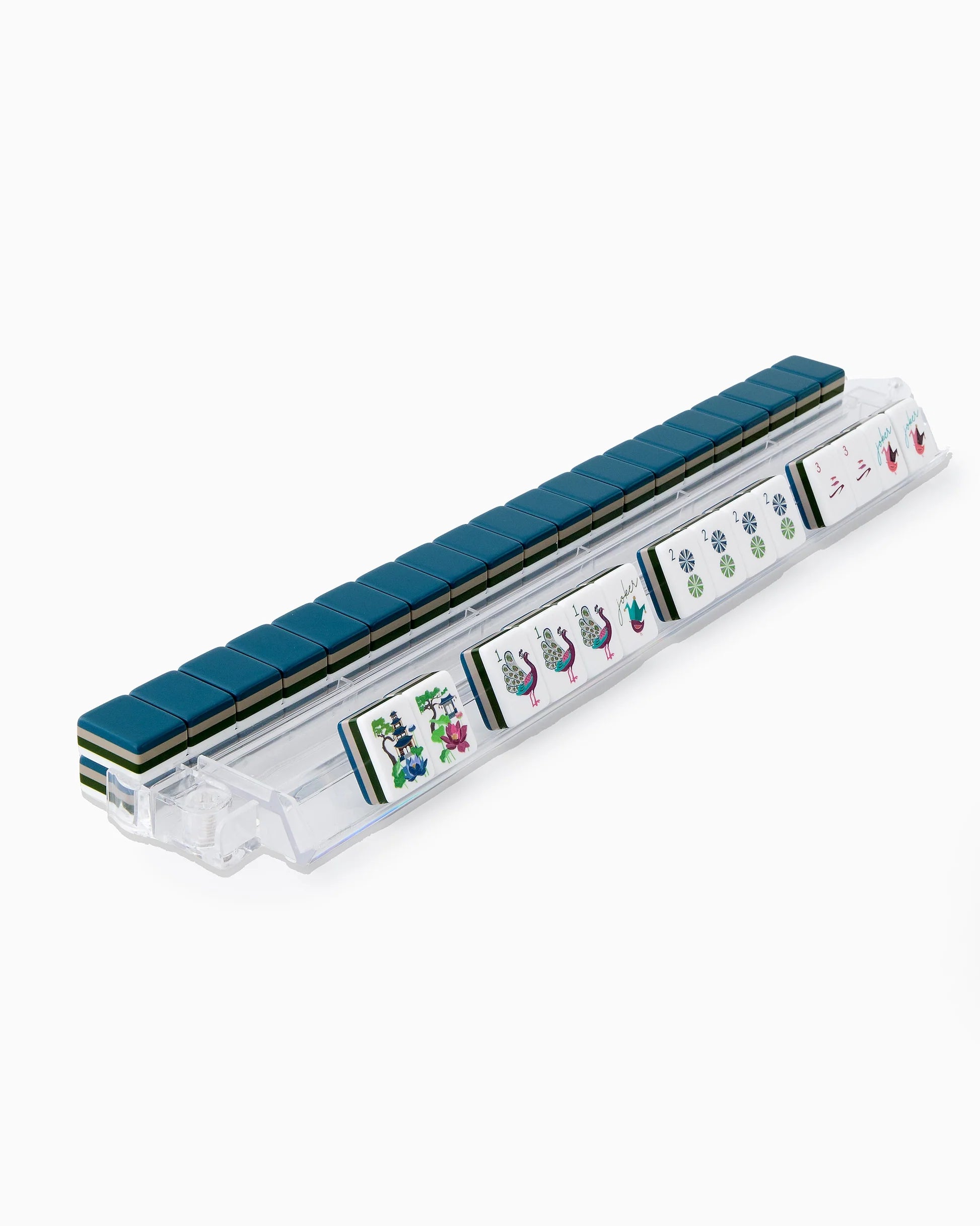 Set of mahjong tiles in a clear plastic case on a white background