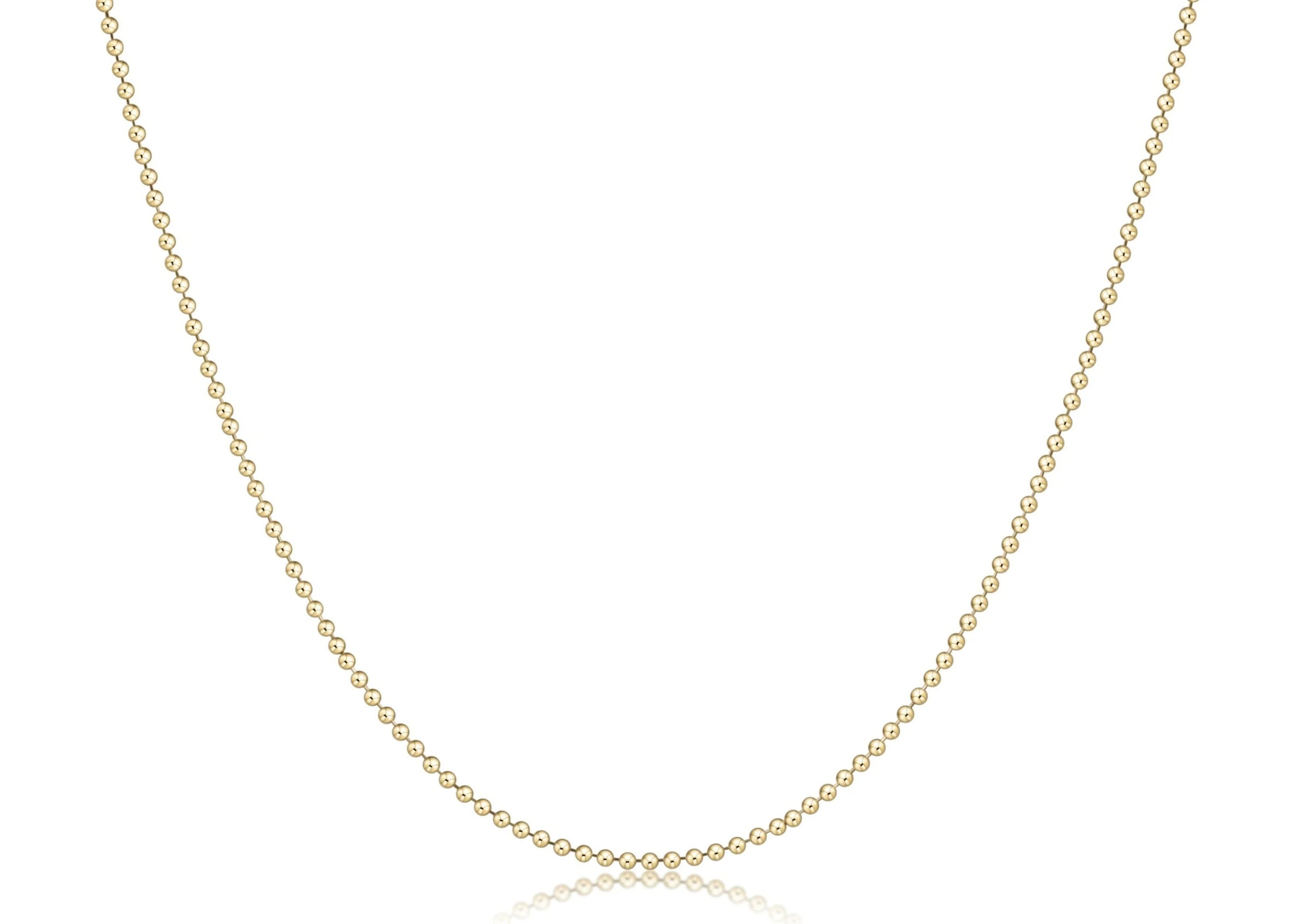 Gold necklace on a white background

