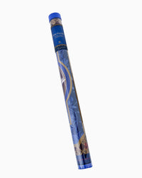 A rolled-up blue and gold patterned mat shown diagonally on a plain white background. The top cap is blue, and the roll features decorative gold and white line art on a blue base.