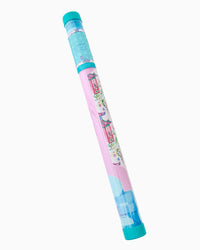 Colorful Mahjong Mat rolled in a clear tube with a pink and blue design on a white background