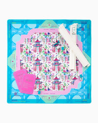 Decorative Mahjong Mat with printed design and tools on a blue background