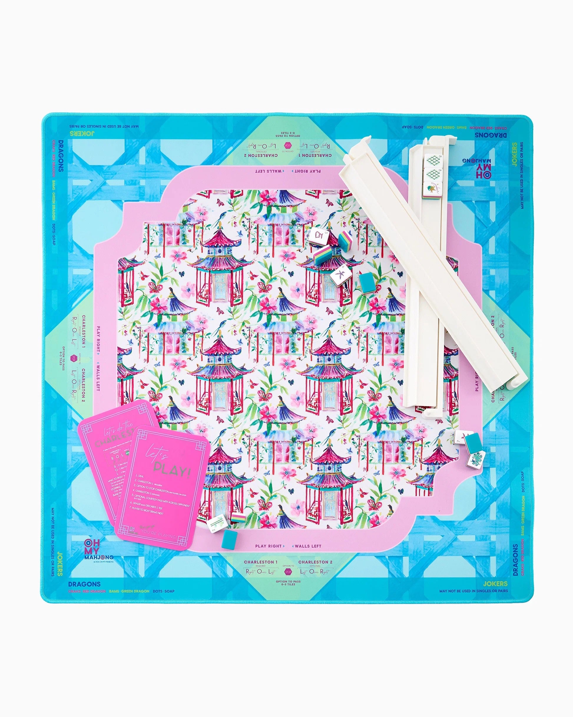 Decorative Mahjong Mat with printed design and tools on a blue background