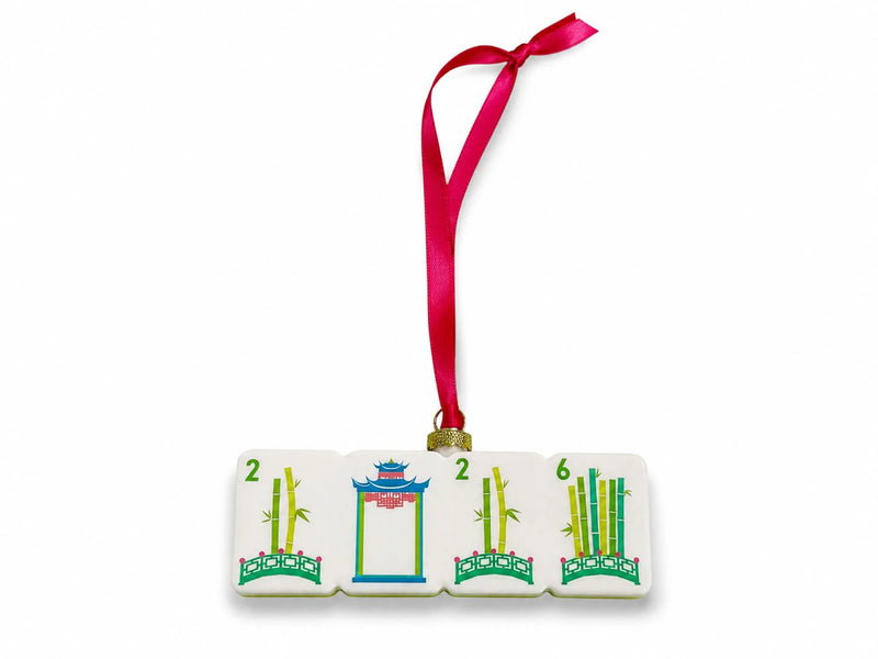 Decorative tile ornament with numbers and designs on a white background
