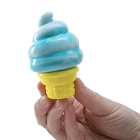 Hand holding a toy ice cream cone with blue soft serve and yellow cone on a white background