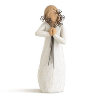 Statue of a person holding flowers on a white background