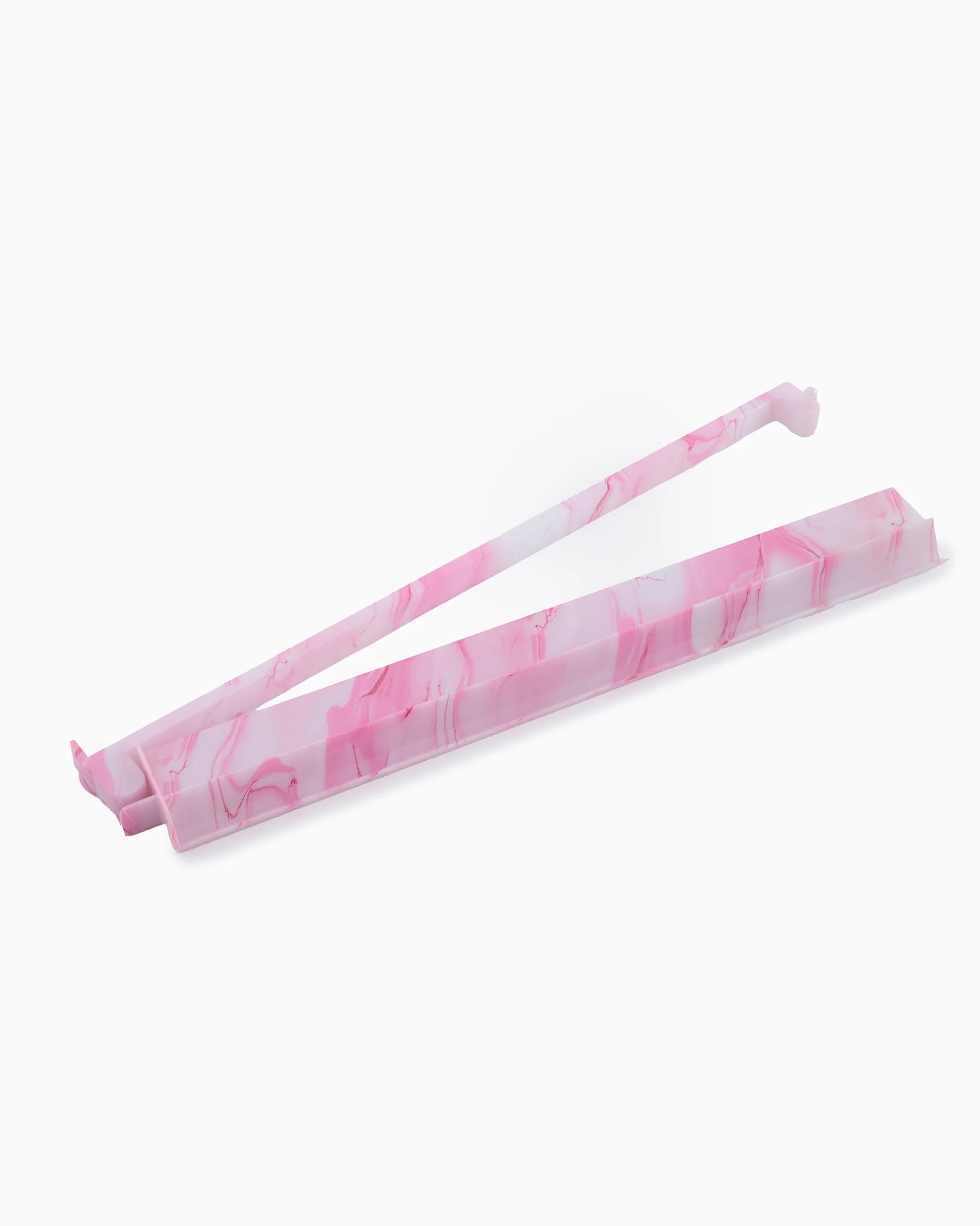 Pink and white marbled mahjong rack and pusher on a white background