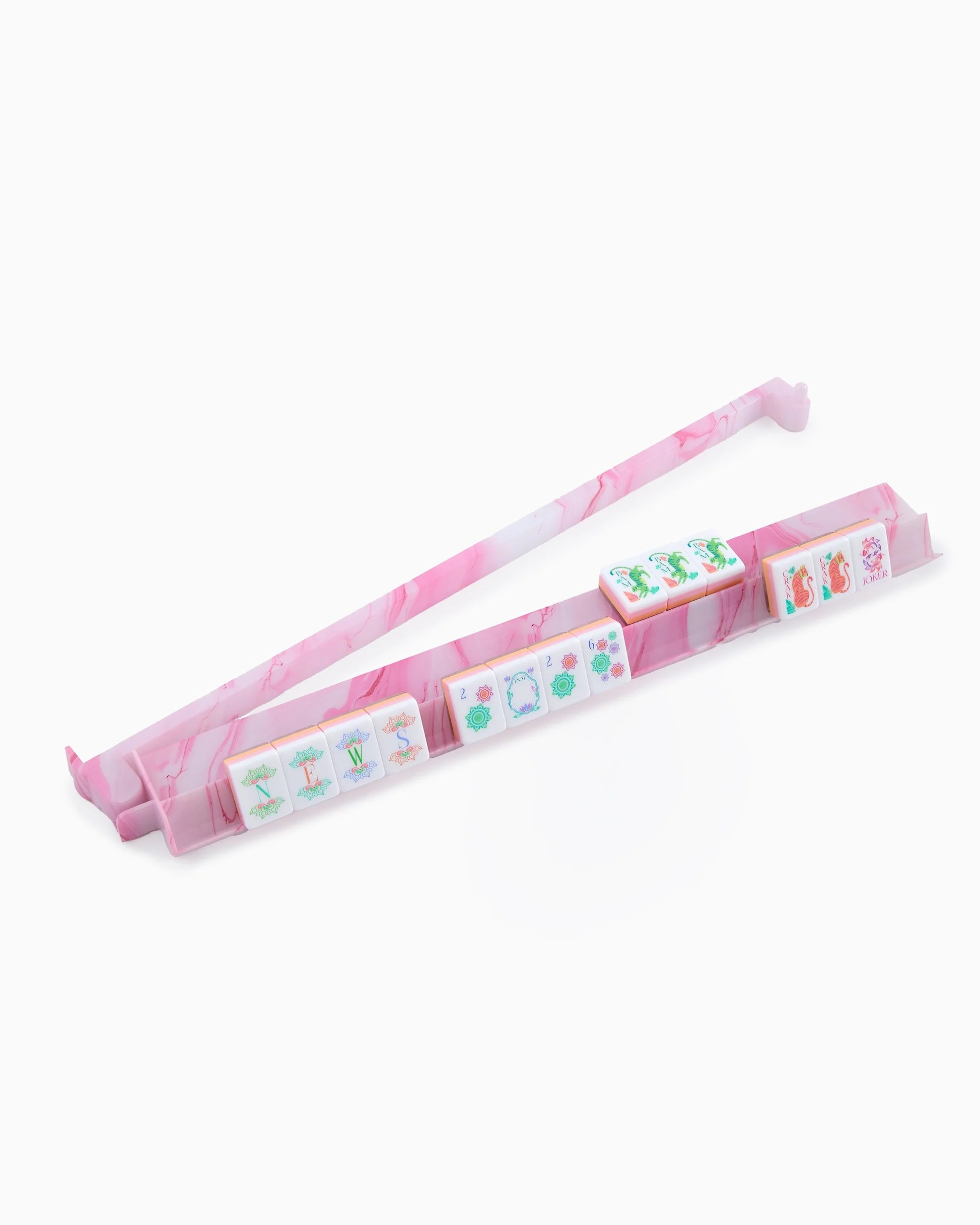 Pink and white marbled mahjong rack on a white background
