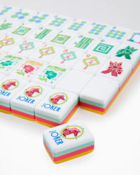 Colorful game pieces with 'Joker' text on a white background