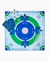 Mahjong Mat with decorative board and components on a white background