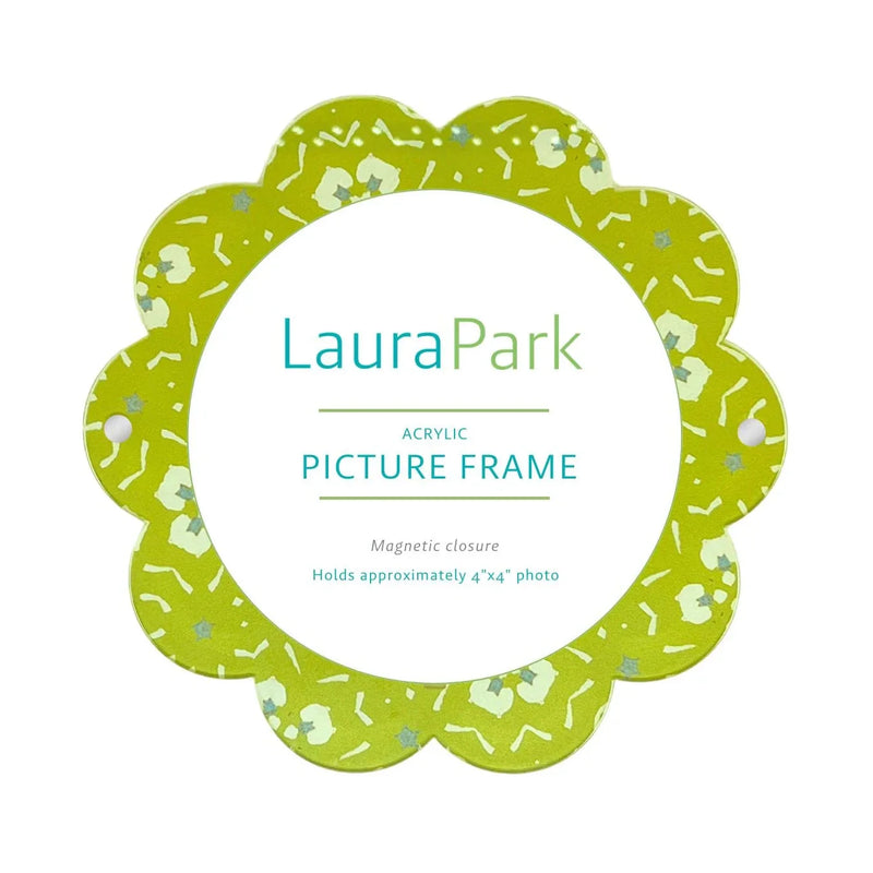 A Laura Park acrylic picture frame with a scalloped edge, featuring a lime green and white patterned border with a white center and teal text.