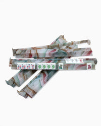 Stack of麻将 (mahjong) racks on a white background
