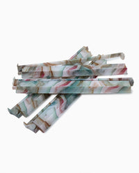 Marbled patterned mahjong racks on a white background