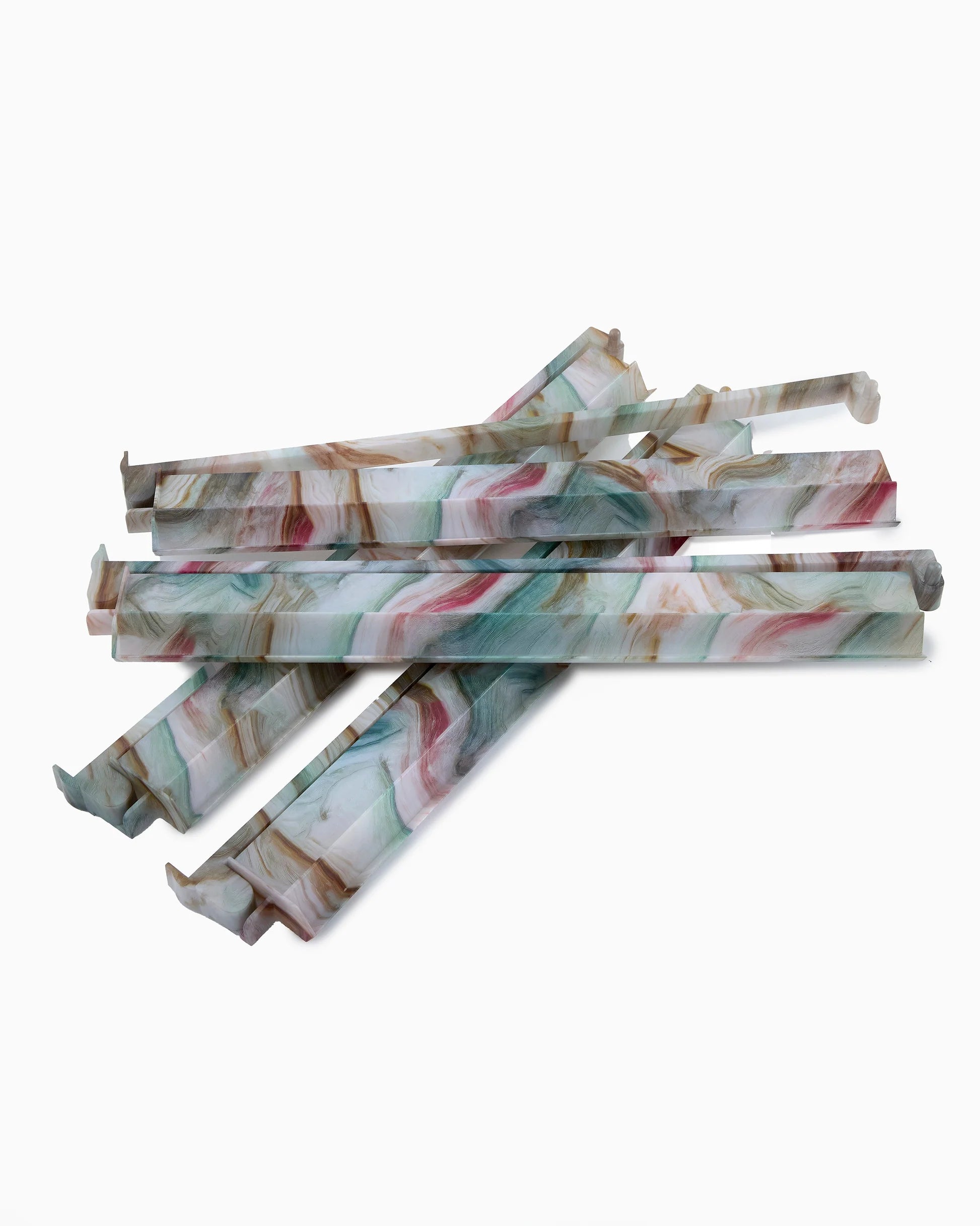 Marbled patterned mahjong racks on a white background