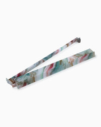 Marble-patterned mahjong racks on a white background