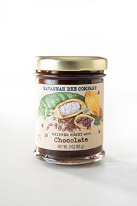 Jar of Savannah Bee Company whipped honey with chocolate on a white background