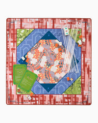 Mahjong mat with colorful board and pieces on a red and white checkered border