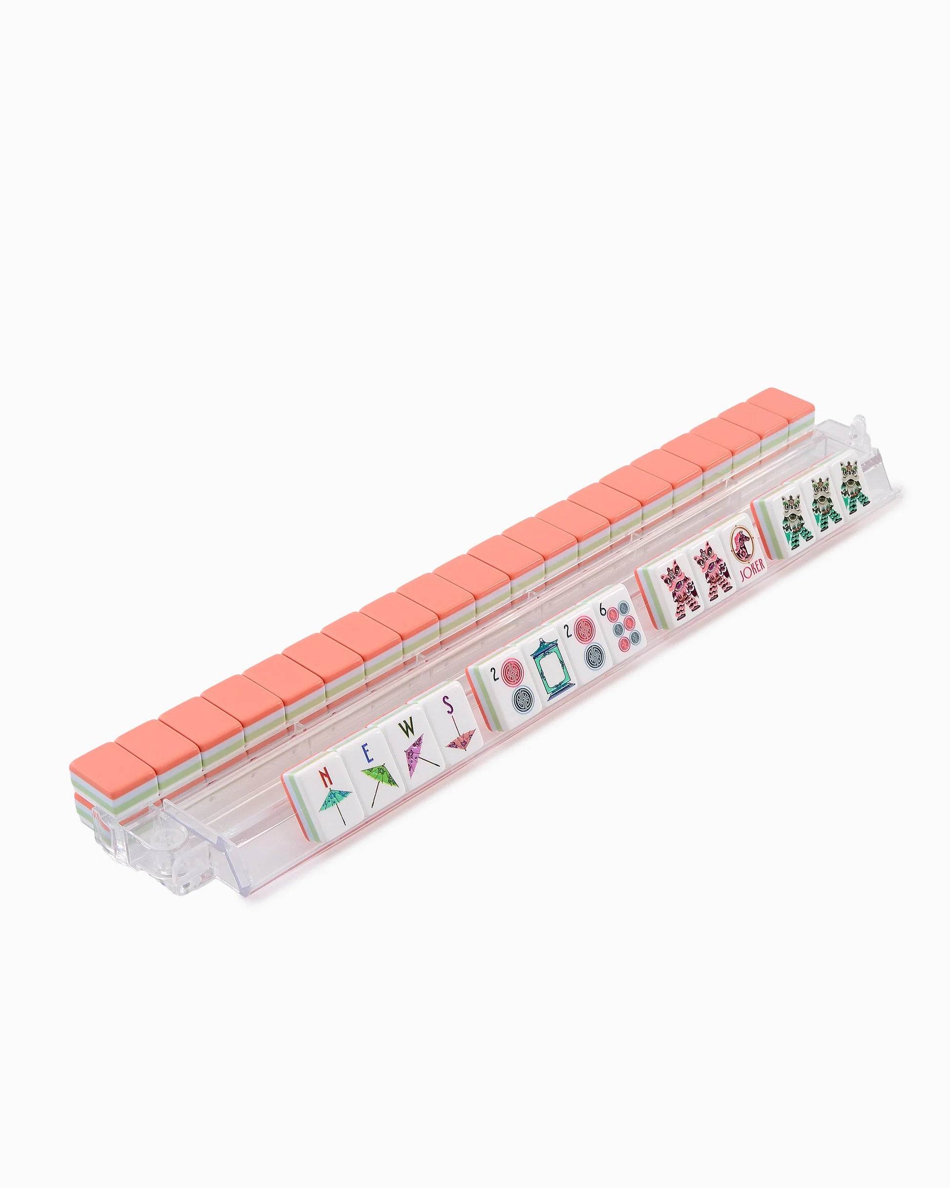 Set of mahjong tiles in a clear plastic case on a white background