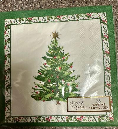 Napkin with a Christmas tree design on a textured surface