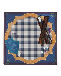 Mahjong setup on a checkered mat with cards and pieces.