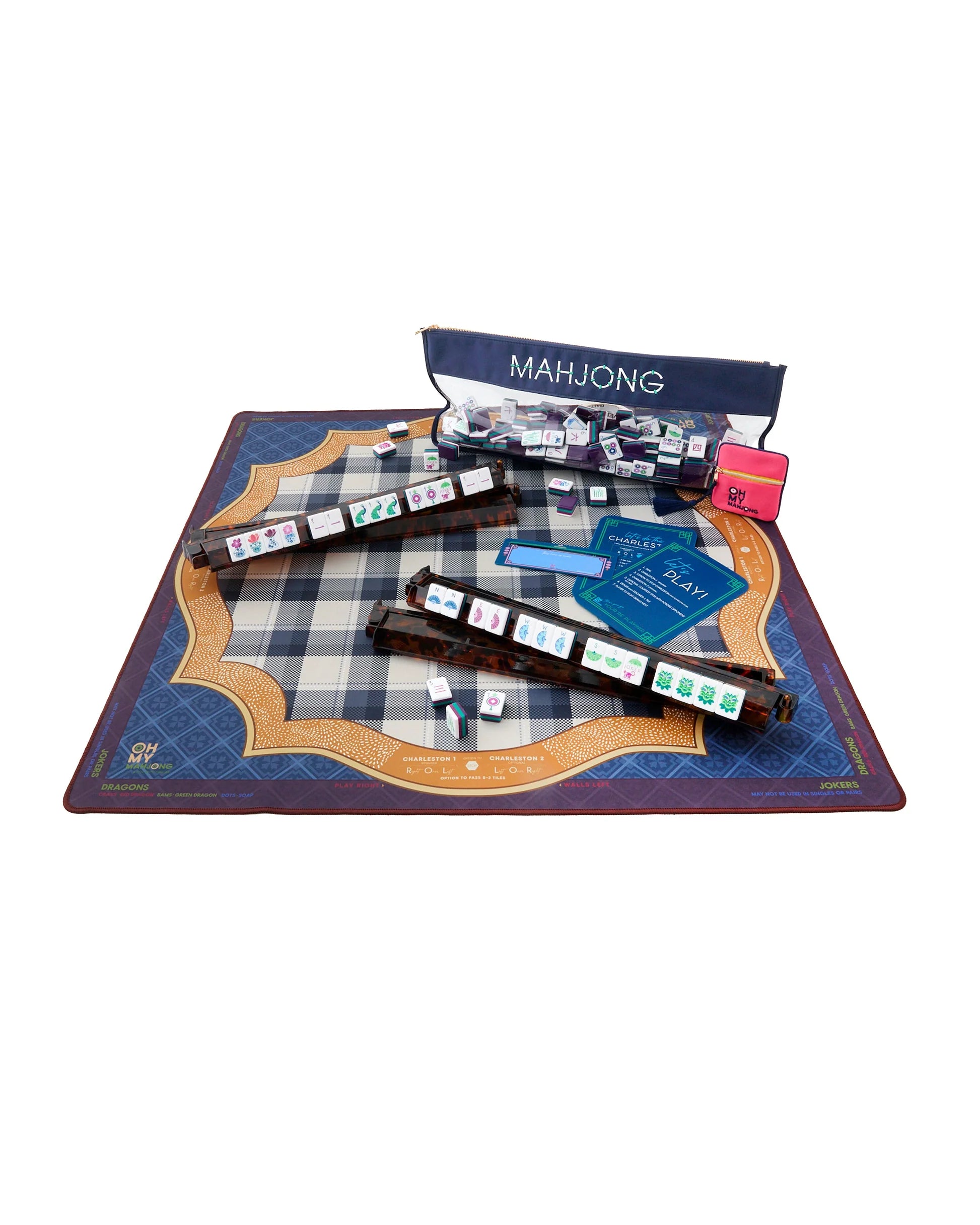 Mahjong game set with tiles and instructions on a checkered mat