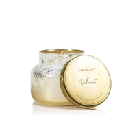 capri BLUE Volcano candle with gold lid on a white background