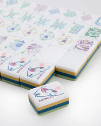 Decorative tiles with cartoon elephant designs on a white background