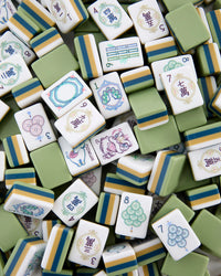 Collection of colorful Mahjong tiles with various designs and numbers.